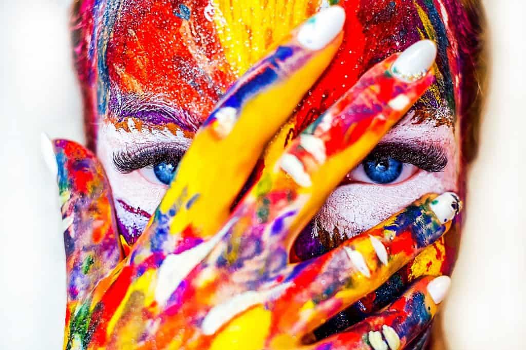 women wearing colourful makeup